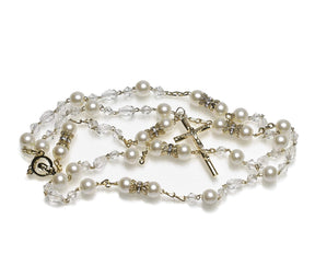 Handcrafted pearl rosary in its standard fifteen Mysteries of the traditional Rosary. This item was designed based on the long-standing custom that was established by Pope Pius V in the 16th century and is available in silver or gold.