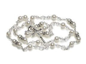 Handcrafted pearl rosary in its standard fifteen Mysteries of the traditional Rosary. This item was designed based on the long-standing custom that was established by Pope Pius V in the 16th century and is available in silver or gold.